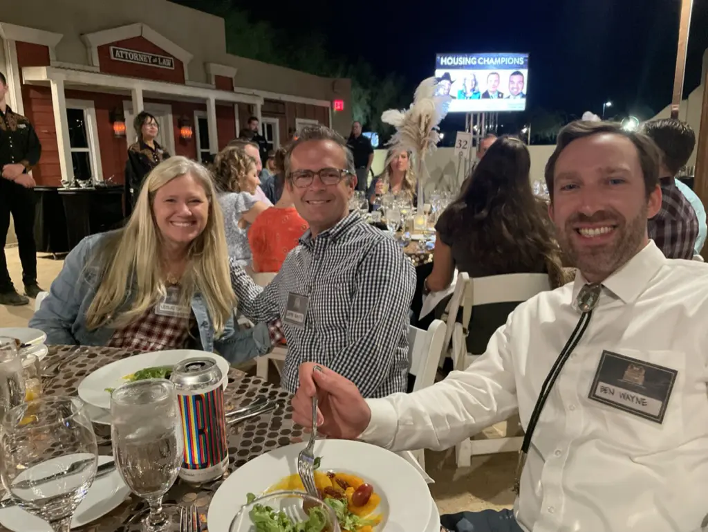 People dining outdoors at an event.